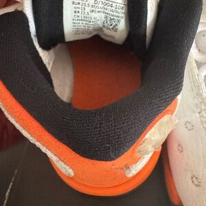 Jordan Orange and Black Athletic Sneakers